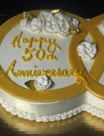 Inter-locking gold rings for a 50th wedding anniversary cake